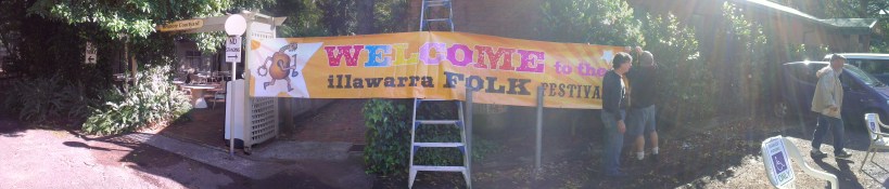How many folkies does it take to erect a banner?