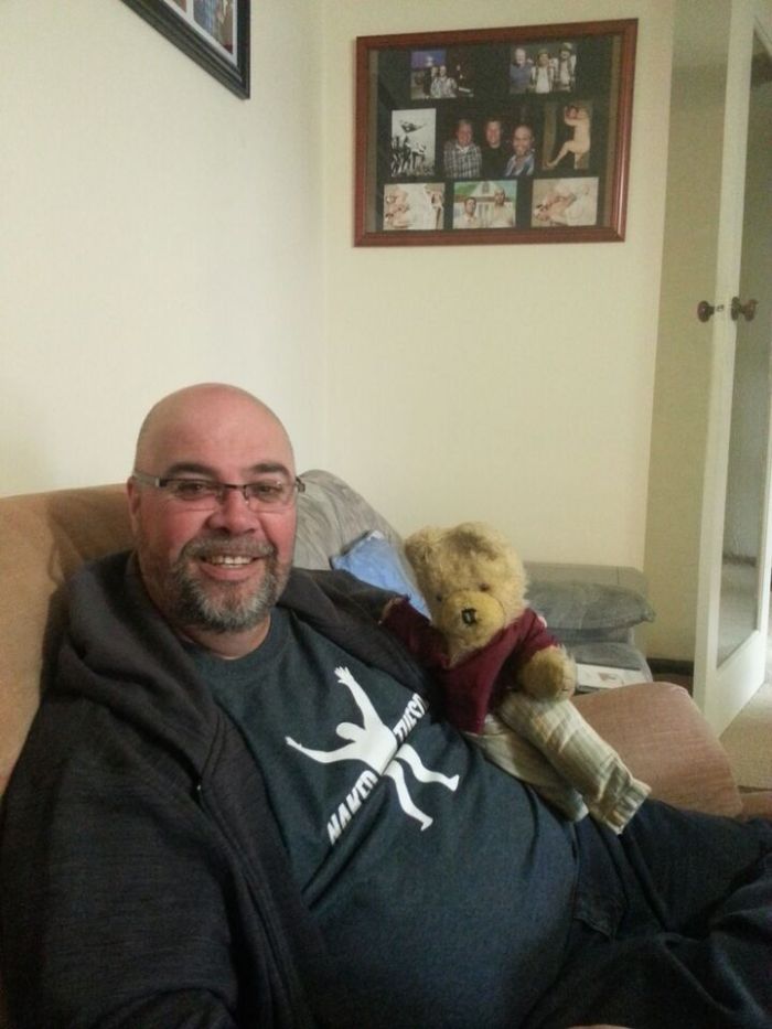 Craig Coombes at home, holding the interviewer's teddy bear, for some reason that I'm sure made perfect sense at the time...
